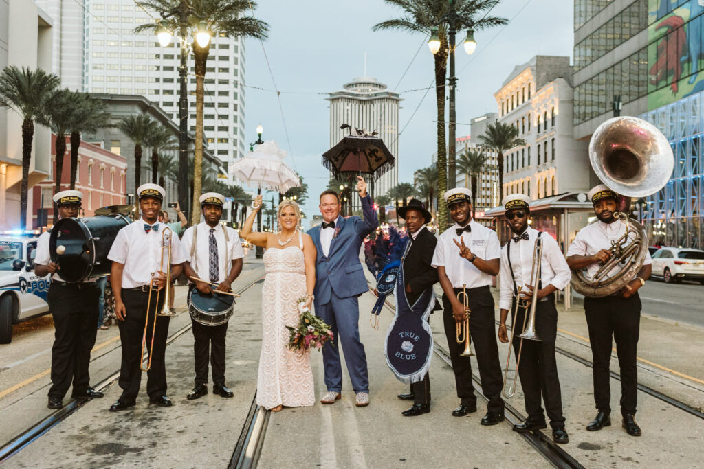 Newlyweds stand with Second Line band in New Orleans