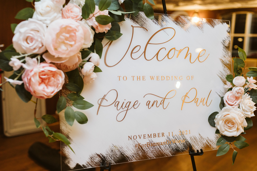 A wedding announcement greets guests at the reception