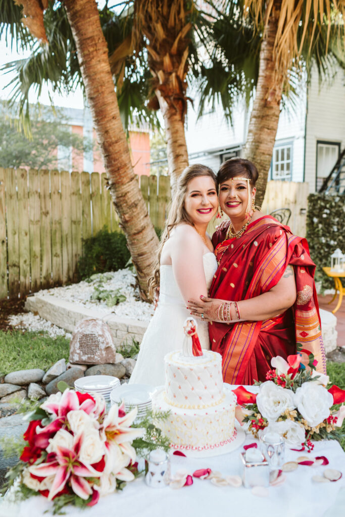 Newlyweds pose with their cake at Canal Street Inn in New Orleans