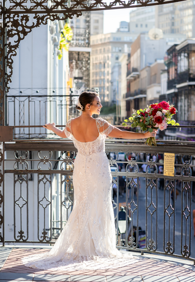 bride poses on balcony