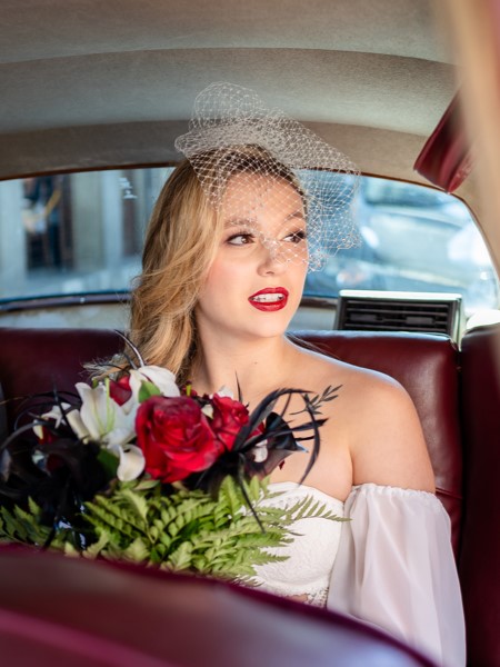 bride arrives to wedding ceremony in a vintage car